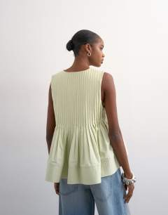 Model wearing V neck pintuck detail a line top in mint