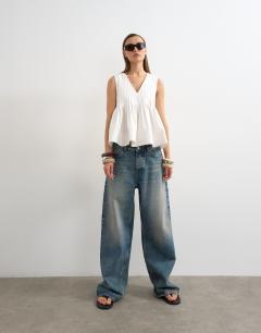 Model wearing V neck pintuck detail a line top in white