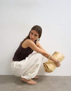 Model wearing V-neck ruched side tank chocolate