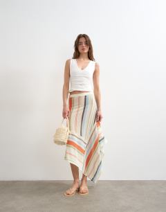 Model wearing V-neck ruched side tank in ivory