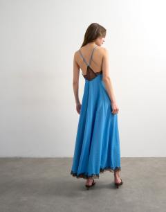 Model wearing V neck satin slip dress with chocolate brown contrast lace inserts in cornflower blue