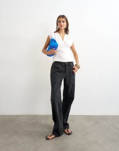 Model wearing V-neck structured waist top in ecru