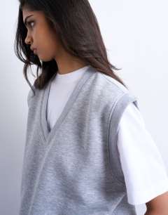 Model wearing V-neck sweat vest in grey marl