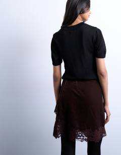Model wearing Velvet asymmetric mini skirt with lace trim in chocolate