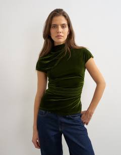 Model wearing Velvet cap sleeve drape front top in green