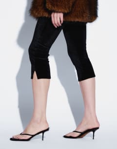 Model wearing Velvet capri trouser in black