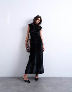 Model wearing Velvet high neck maxi dress in black
