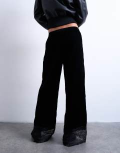 Model wearing Velvet lace insert trouser in black
