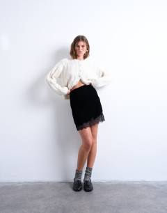 Model wearing Velvet lace mini skirt in black
