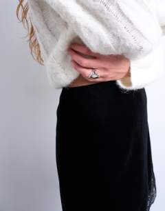Model wearing Velvet lace mini skirt in black