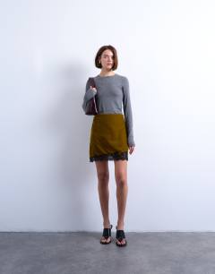 Model wearing Velvet lace mini skirt in olive