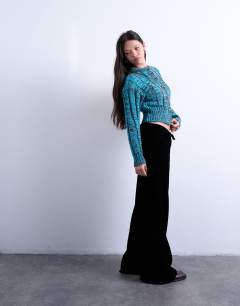 Model wearing Velvet mid rise tie waist wide leg jogger in black