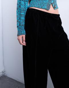 Model wearing Velvet mid rise tie waist wide leg jogger in black