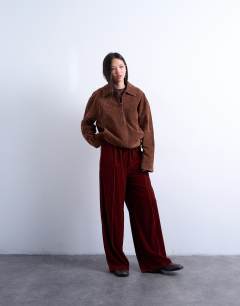 Model wearing Velvet mid rise tie waist wide leg jogger in tobacco