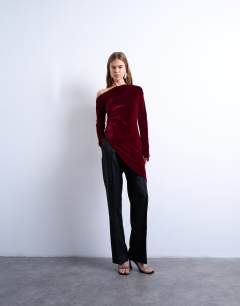 Model wearing Velvet off shoulder tunic long sleeve top in burgundy