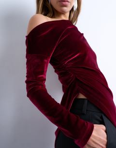 Model wearing Velvet off shoulder tunic long sleeve top in burgundy