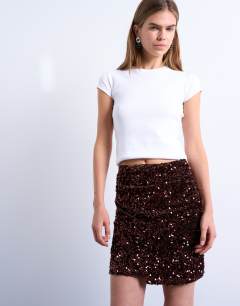 Model wearing Velvet sequin drape mini skirt in chocolate