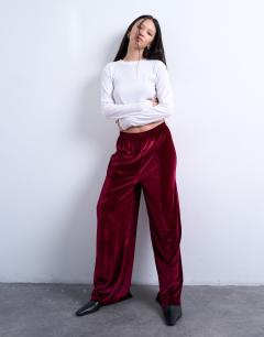 Model wearing Velvet wide leg pull on trouser in burgundy