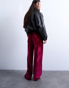 Model wearing Velvet wide leg pull on trouser in burgundy