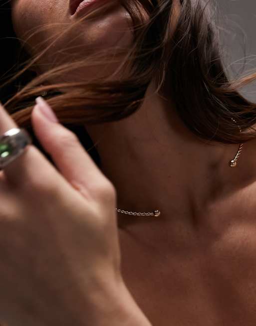 Topshop – Vienna – Sztywny naszyjnik choker o skręconym splocie w kolorze złota