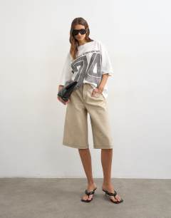 Model wearing Topshop 'Vintage 74' graphic tee in white