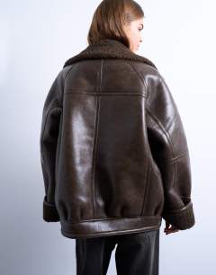 Model wearing Vintage wash shearling aviator bomber in chocolate