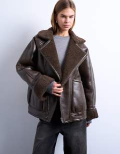 Model wearing Vintage wash shearling aviator bomber in chocolate