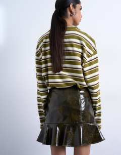 Model wearing Vinyl peplum hem mini skirt in green