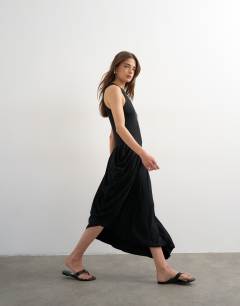 Model wearing Viscose drape bubble hem racer maxi dress in black