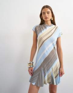 Model wearing Viscose grown on sleeve dress in blue and grey stripe