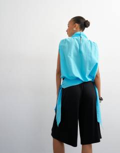 Model wearing Viscose jersey bermuda short in black