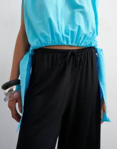 Model wearing Viscose jersey bermuda short in black