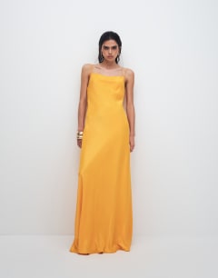 Model wearing Viscose satin low scoop flood length maxi slip dress in orange