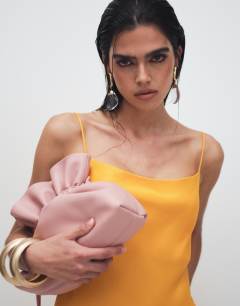 Model wearing Viscose satin low scoop flood length maxi slip dress in orange