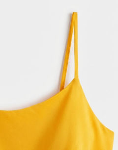 Model wearing Viscose satin low scoop flood length maxi slip dress in orange