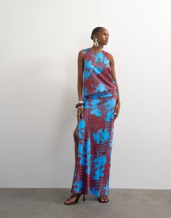 Model wearing Viscose satin racer neck blouson dropped asymmetric waist maxi dress in brown wavy floral print