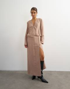 Model wearing Viscose satin stripe dropped waist long sleeve wrap front maxi dress in taupe