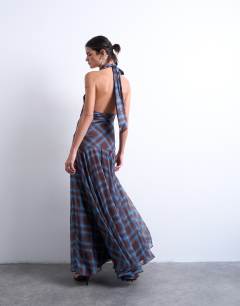Model wearing Volume hem dropped waist maxi dress in blue check chiffon