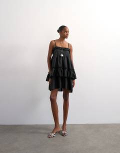 Model wearing Voluminous frill midi dress in black