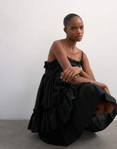 Model wearing Voluminous frill midi dress in black