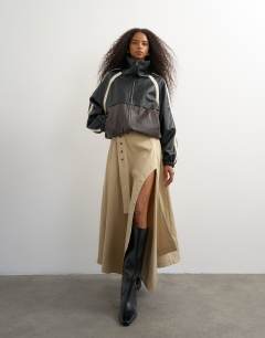 Model wearing Waist detail asymmetric hem trench skirt in stone