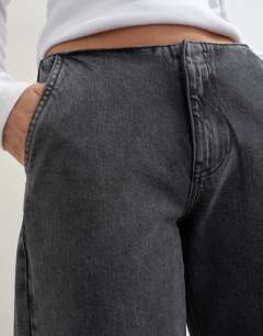 Model wearing Waistbandless relaxed straight jean in washed black