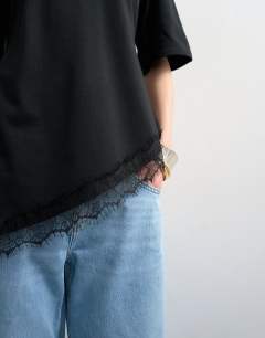 Model wearing Waisted lace trim tee in black
