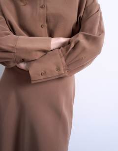 Model wearing Waisted micro mini shirt dress in brown cupro