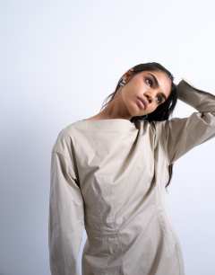 Model wearing Waisted ovoid sleeve slash neck mini dress in taupe