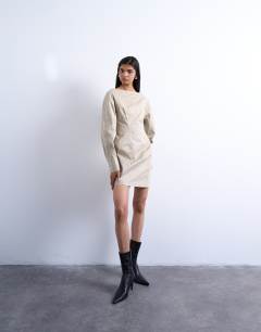 Model wearing Waisted ovoid sleeve slash neck mini dress in taupe