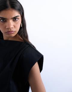 Model wearing Waisted structured shoulder top in black