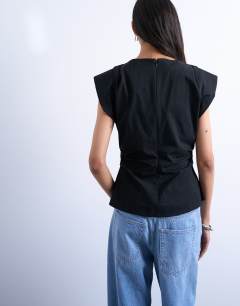 Model wearing Waisted structured shoulder top in black