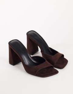 Model wearing Walter high heeled mule in chocolate faux suede