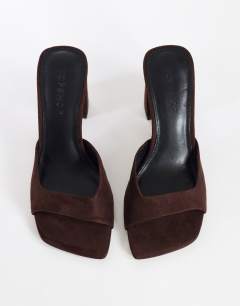 Model wearing Walter high heeled mule in chocolate faux suede